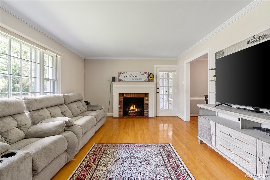 5038 Grassmere Road Richmond, VA 23234 - Photo 16 of 50 a living room with furniture and a flat screen tv