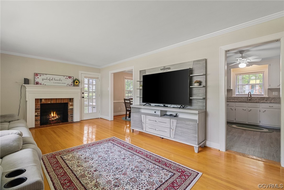 5038 Grassmere Road Richmond, VA 23234 - Photo 17 of 50 a living room with furniture and a flat screen tv