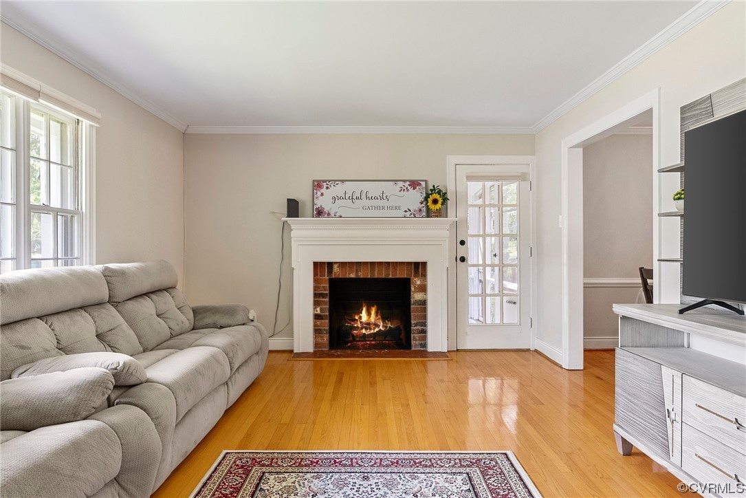 5038 Grassmere Road Richmond, VA 23234 - Photo 18 of 50 a living room with furniture and a fireplace