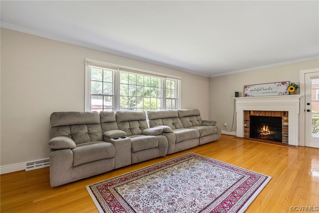 5038 Grassmere Road Richmond, VA 23234 - Photo 19 of 50 a living room with furniture and a fireplace