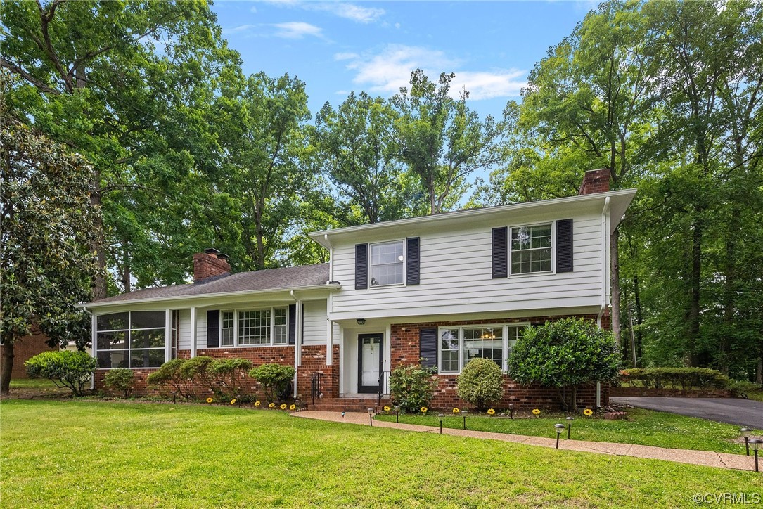 5038 Grassmere Road Richmond, VA 23234 - Photo 2 of 50 a front view of house with yard and green space