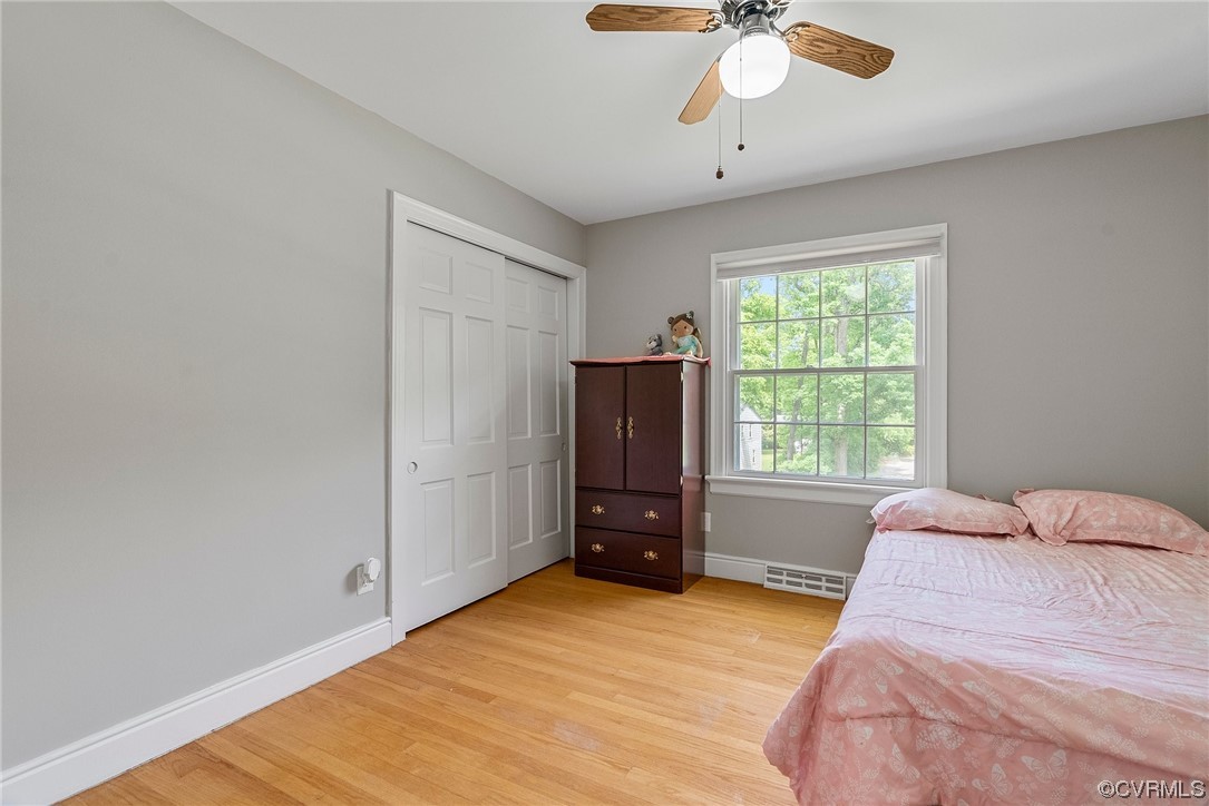 5038 Grassmere Road Richmond, VA 23234 - Photo 28 of 50 a bedroom with a bed and a chandelier