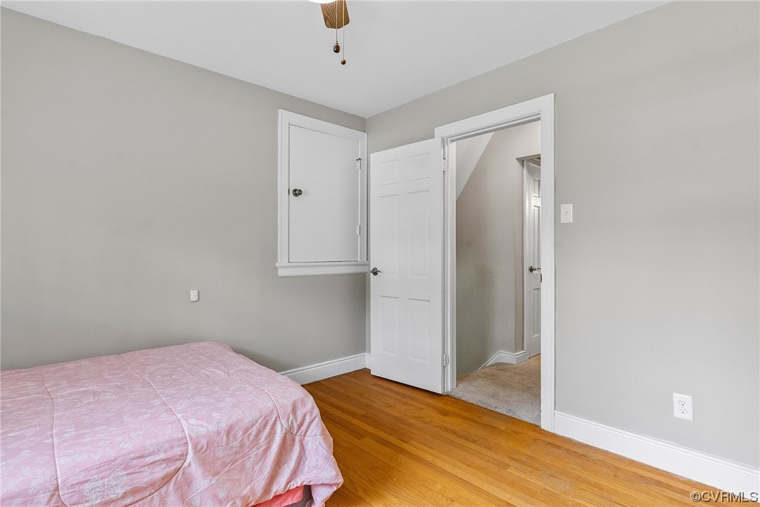 5038 Grassmere Road Richmond, VA 23234 - Photo 30 of 50 a bedroom with a bed and wooden floor
