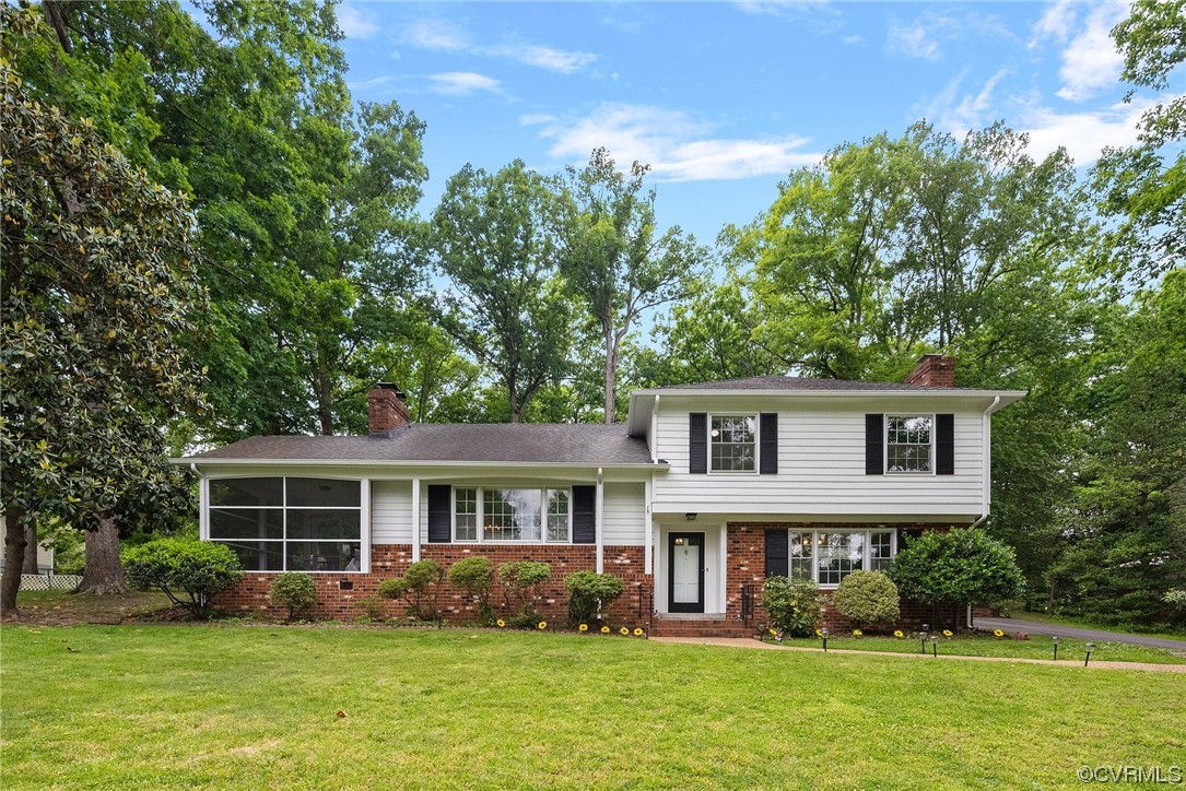 5038 Grassmere Road Richmond, VA 23234 - Photo 3 of 50 a front view of a house with garden and trees