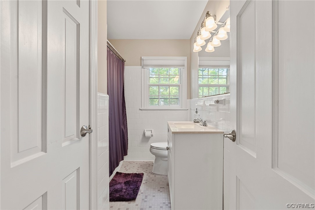 5038 Grassmere Road Richmond, VA 23234 - Photo 31 of 50 a bathroom with a sink a toilet and shower