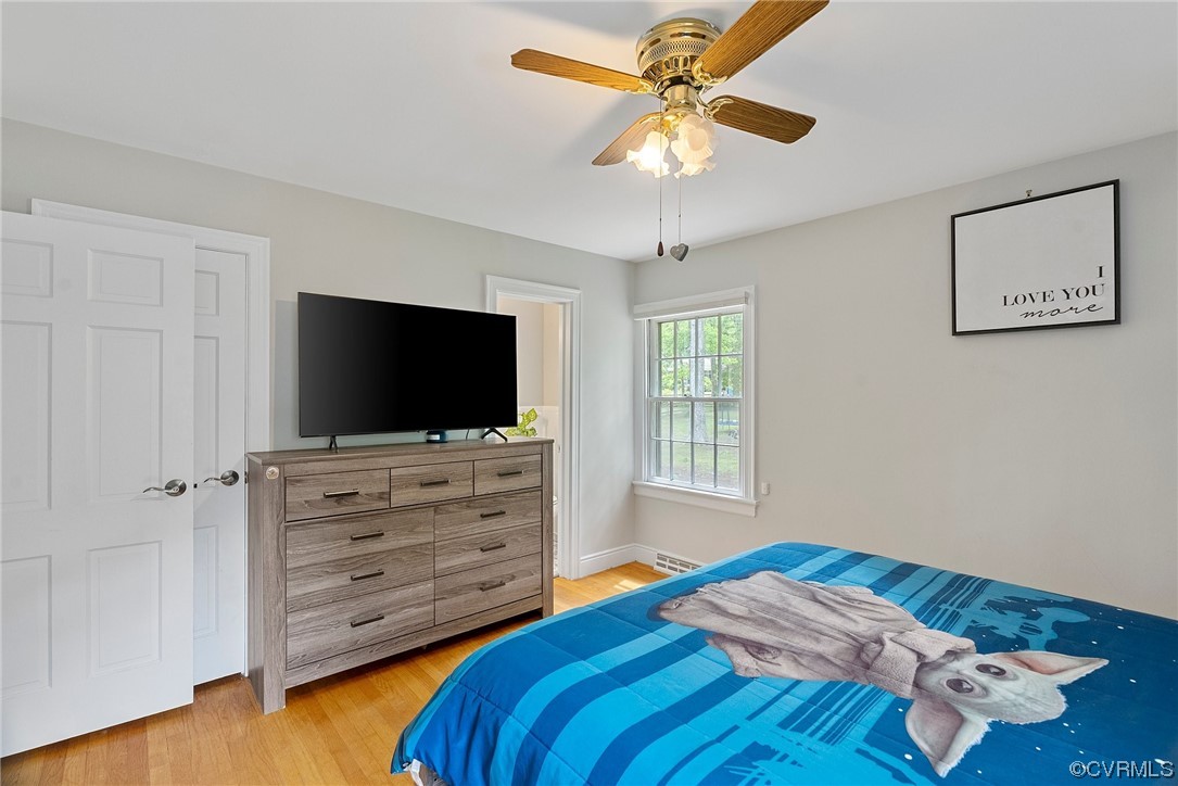 5038 Grassmere Road Richmond, VA 23234 - Photo 35 of 50 a bedroom with a bed and a flat screen tv