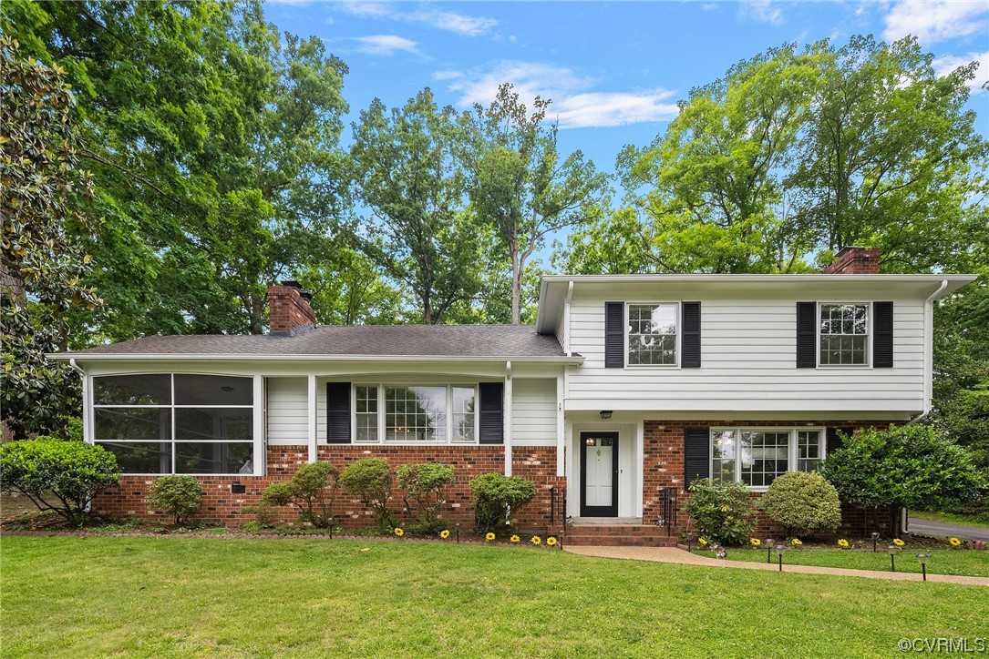 5038 Grassmere Road Richmond, VA 23234 - Photo 4 of 50 a front view of house with yard and green space