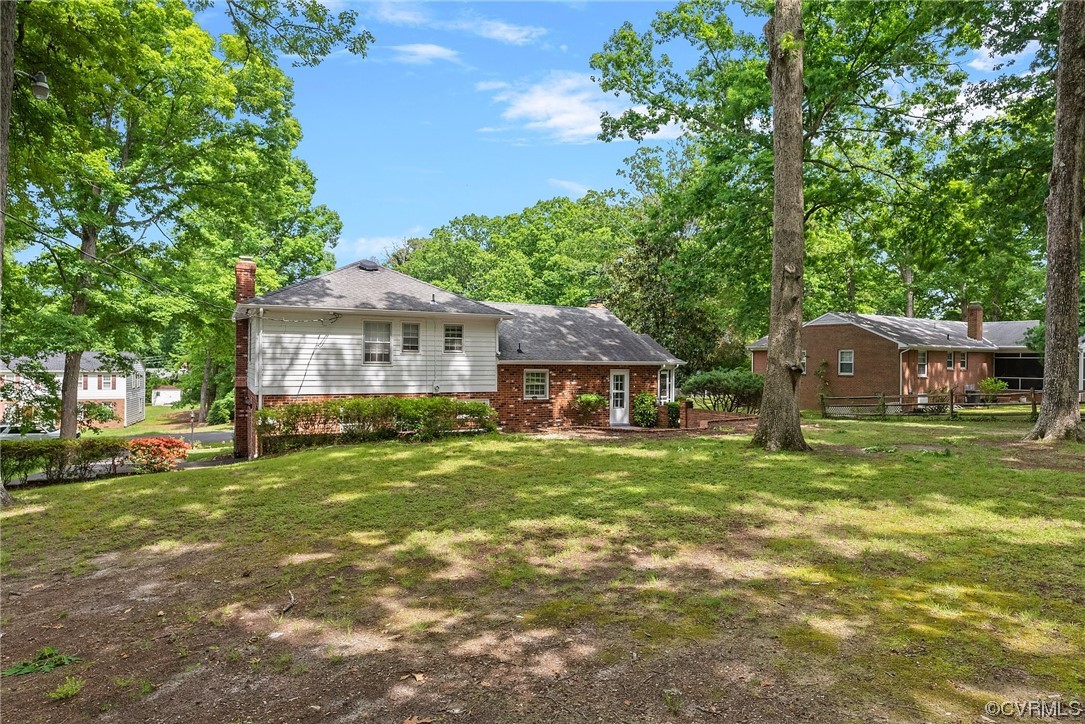 5038 Grassmere Road Richmond, VA 23234 - Photo 43 of 50 a front view of a house with a garden