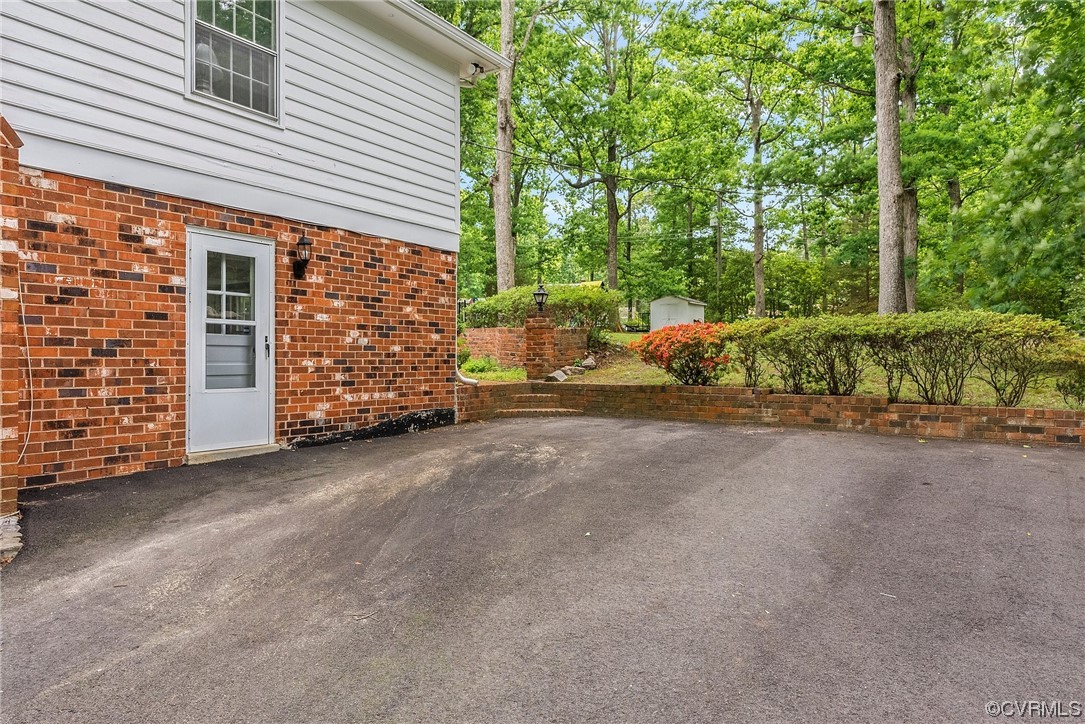 5038 Grassmere Road Richmond, VA 23234 - Photo 44 of 50 a view of a house with a yard and garage