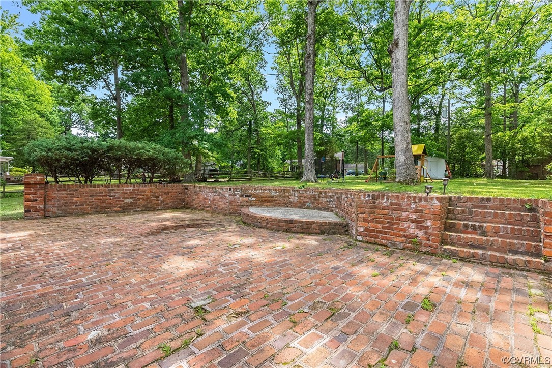 5038 Grassmere Road Richmond, VA 23234 - Photo 46 of 50 a view of a yard with plants and trees