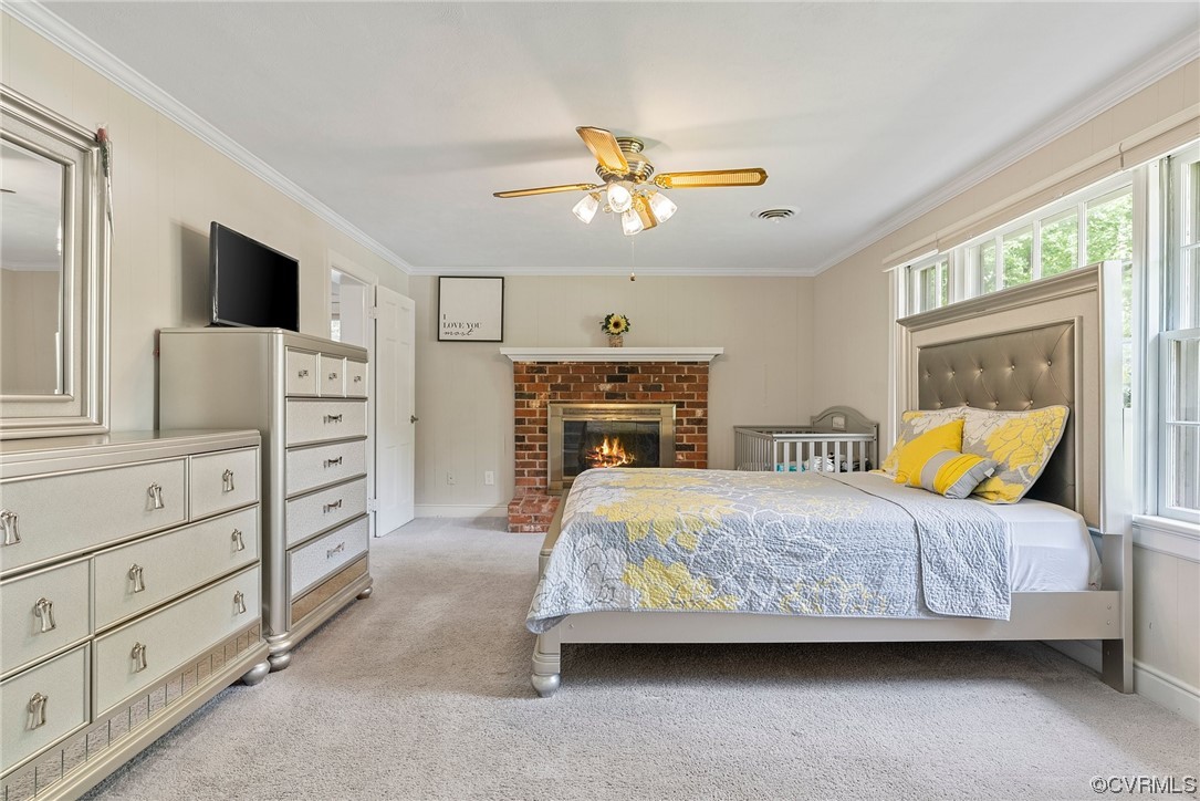 5038 Grassmere Road Richmond, VA 23234 - Photo 7 of 50 a bedroom with a bed a chandelier and a flat tv screen