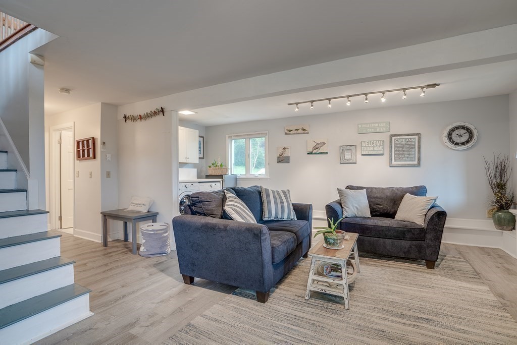 7 Brooks Road Gloucester, MA 01930 - Photo 11 of 33 a living room with furniture and a wooden floor