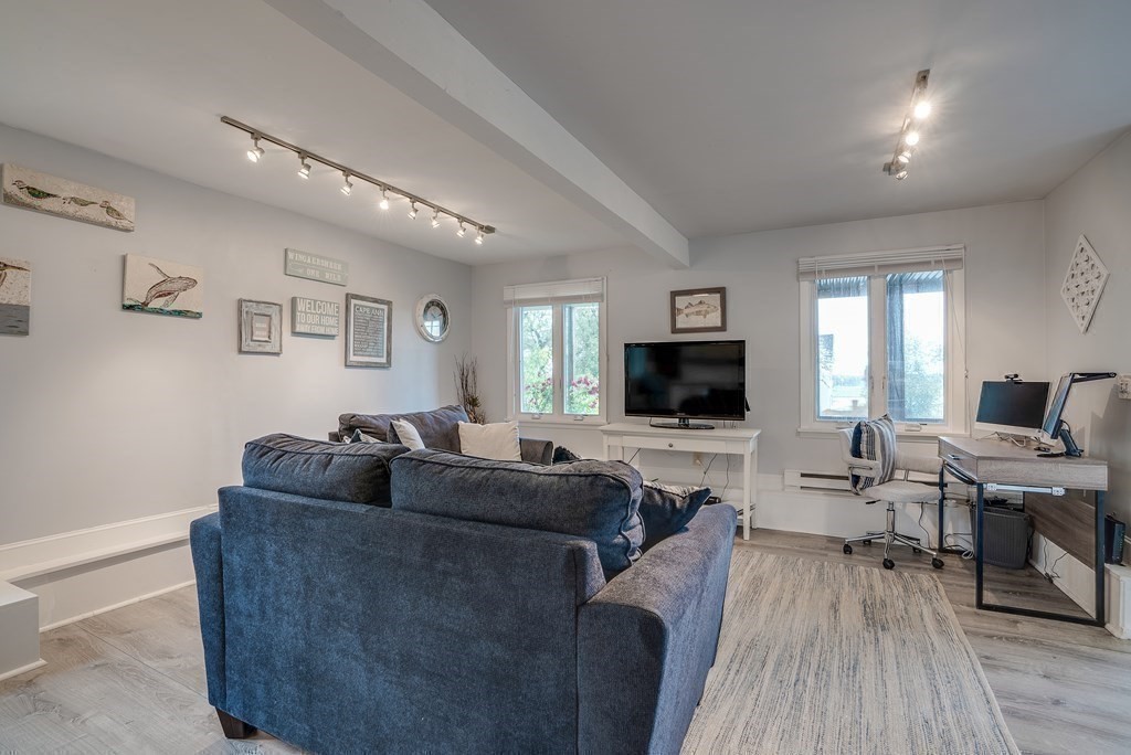 7 Brooks Road Gloucester, MA 01930 - Photo 12 of 33 a living room with furniture and a flat screen tv