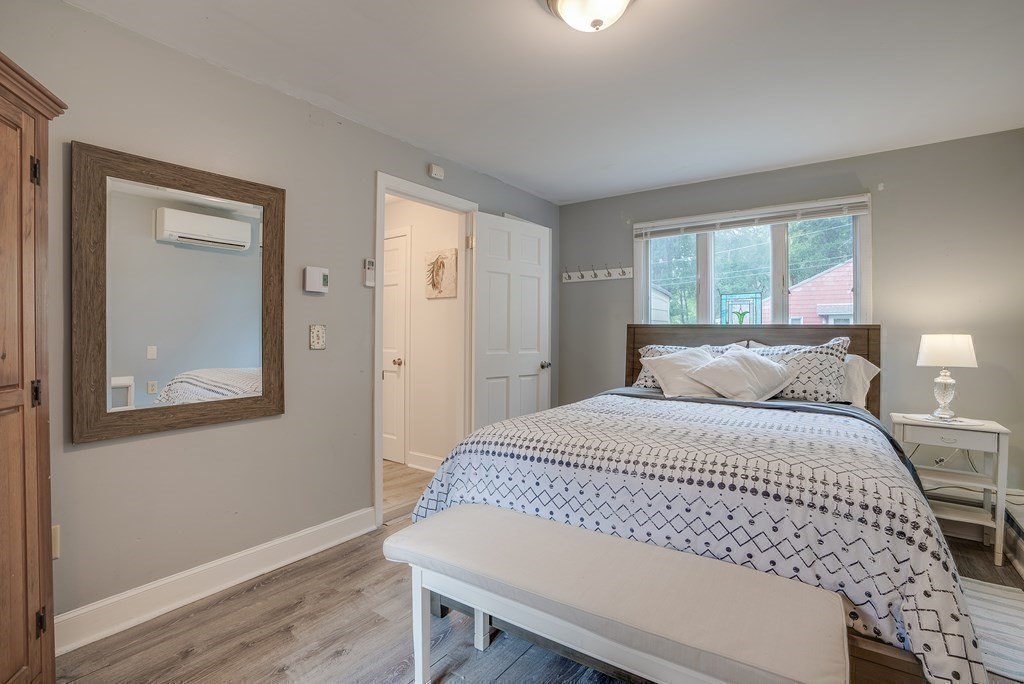 7 Brooks Road Gloucester, MA 01930 - Photo 14 of 33 a bedroom with a bed and wooden floor