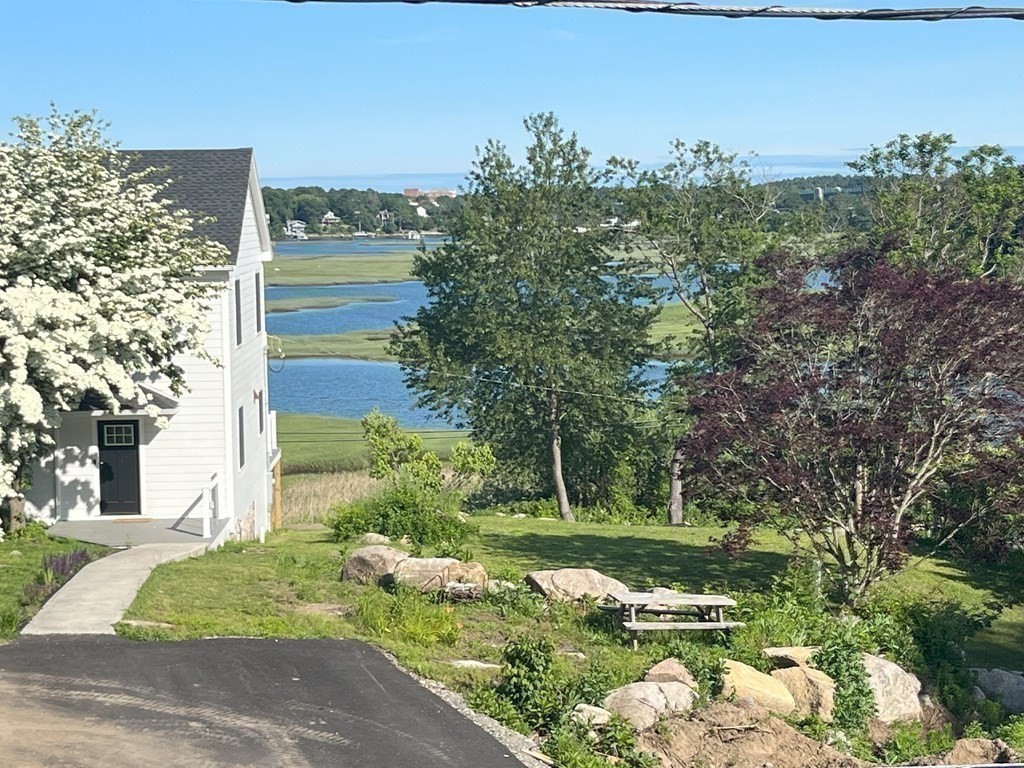 7 Brooks Road Gloucester, MA 01930 - Photo 19 of 33 a view of a garden with a building in the background