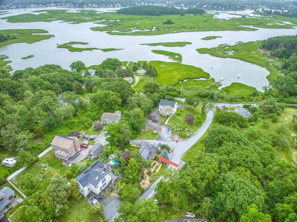 7 Brooks Road Gloucester, MA 01930 - Photo 2 of 33 a view of a lake with a building in the background