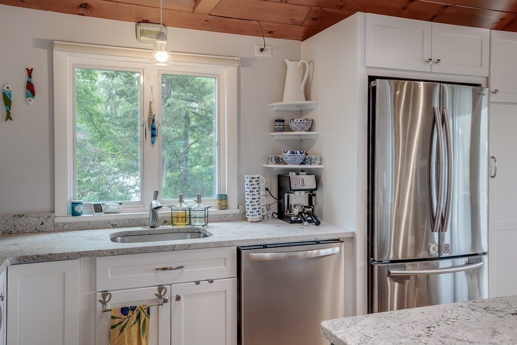 7 Brooks Road Gloucester, MA 01930 - Photo 24 of 33 a kitchen with stainless steel appliances granite countertop a refrigerator and a sink