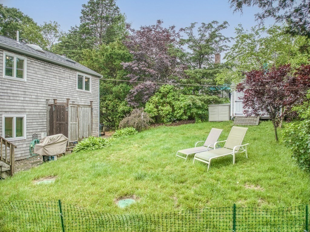 7 Brooks Road Gloucester, MA 01930 - Photo 30 of 33 a view of a chair and table in backyard of the house