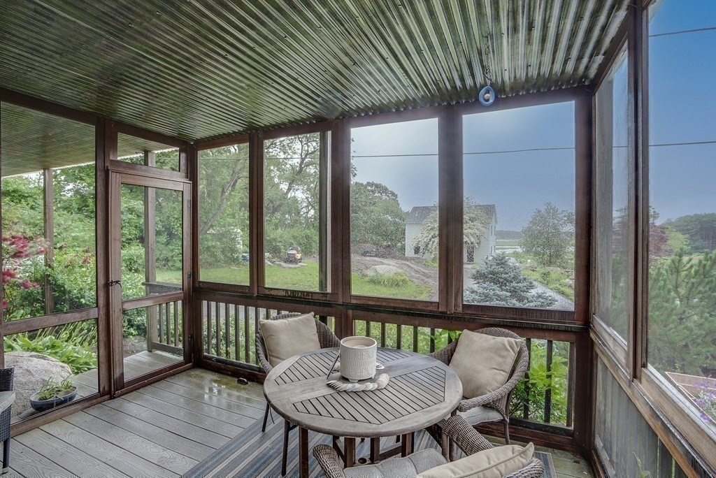 7 Brooks Road Gloucester, MA 01930 - Photo 8 of 33 a view of a porch with furniture and wooden floor