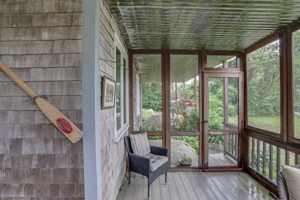 7 Brooks Road Gloucester, MA 01930 - Photo 9 of 33 a balcony with chairs and wooden floor