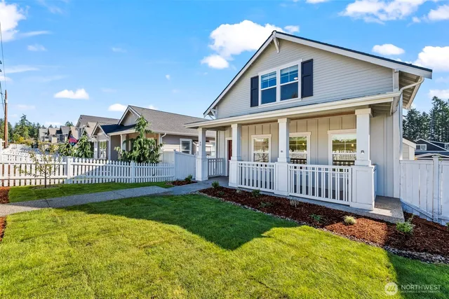 a view of a house with a yard and a garden