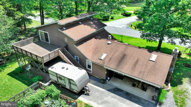 a view of a patio with table and chairs
