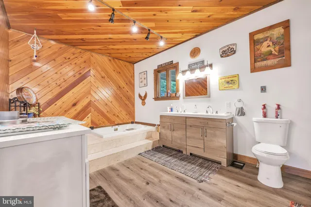 a view of an empty room with natural light