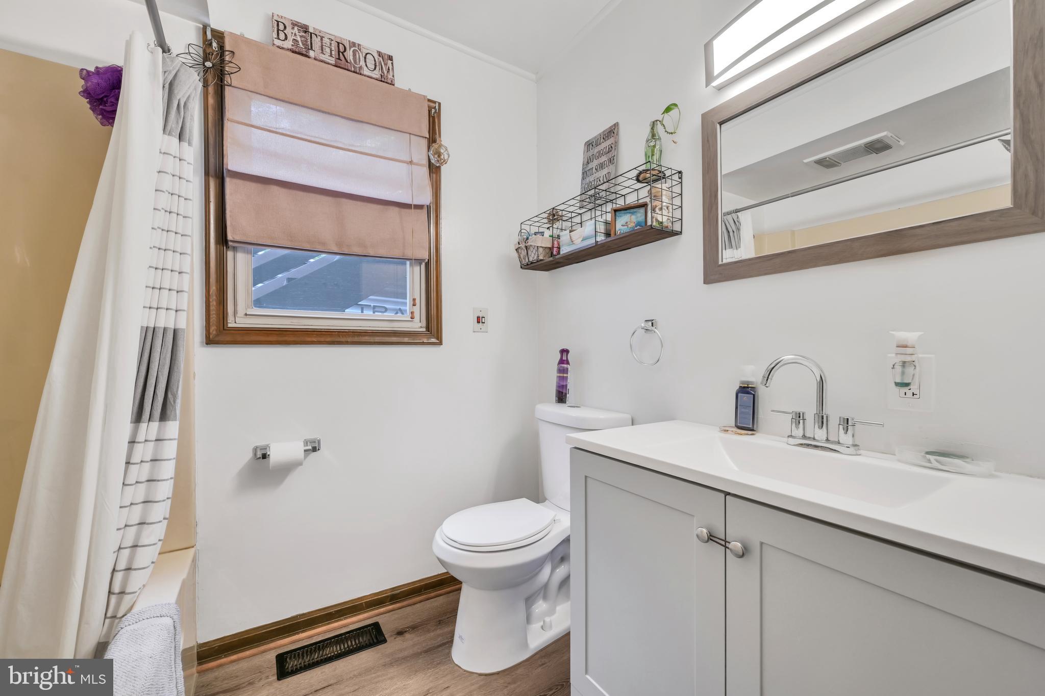 3511 Mountain Road Slatington, PA 18080 - Photo 5 of 27 a bathroom with a toilet sink and mirror