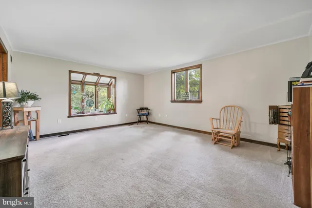 a view of an empty room with natural light