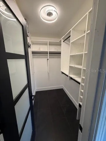 a view of an empty walk in closet
