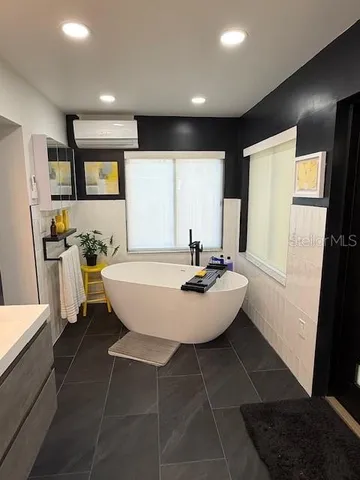 a view of a dining room with furniture and window