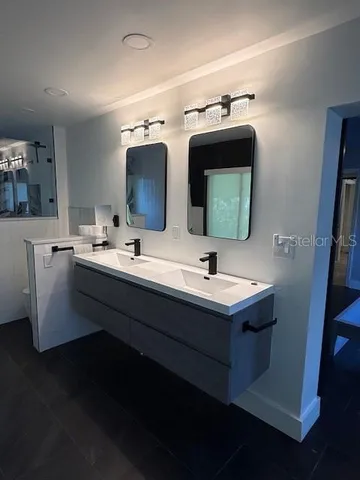 a bathroom with a sink and a mirror