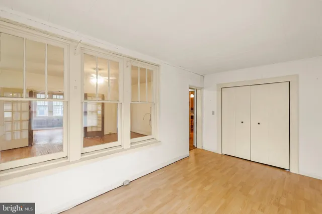 a view of an empty room with glass door