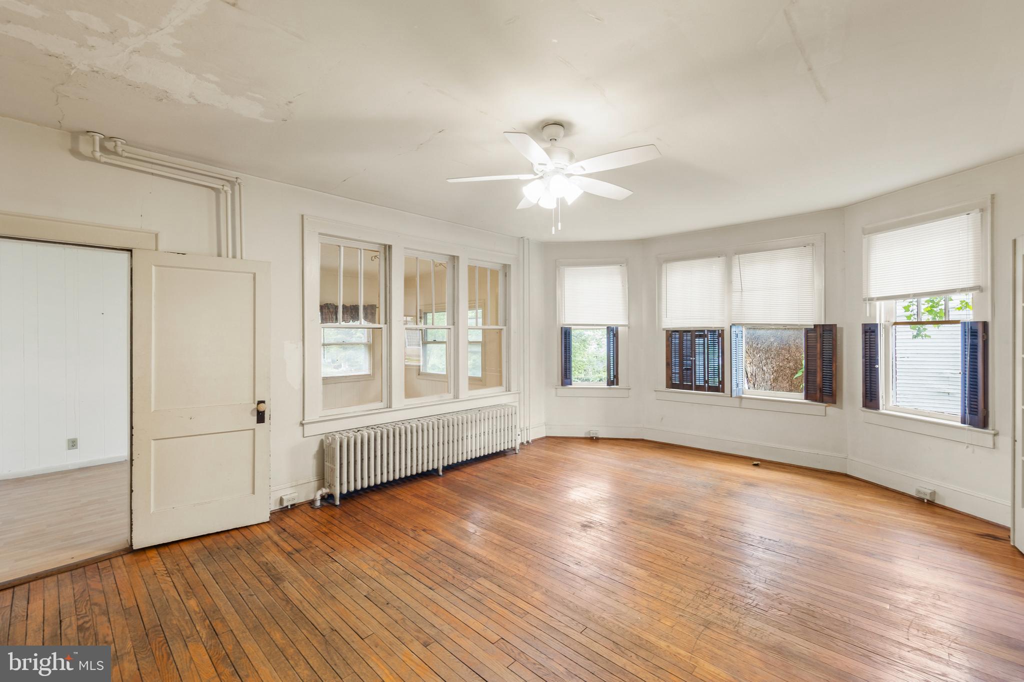 5342 Main Street Stephens City, VA 22655 - Photo 16 of 45 a view of an empty room with wooden floor and a window