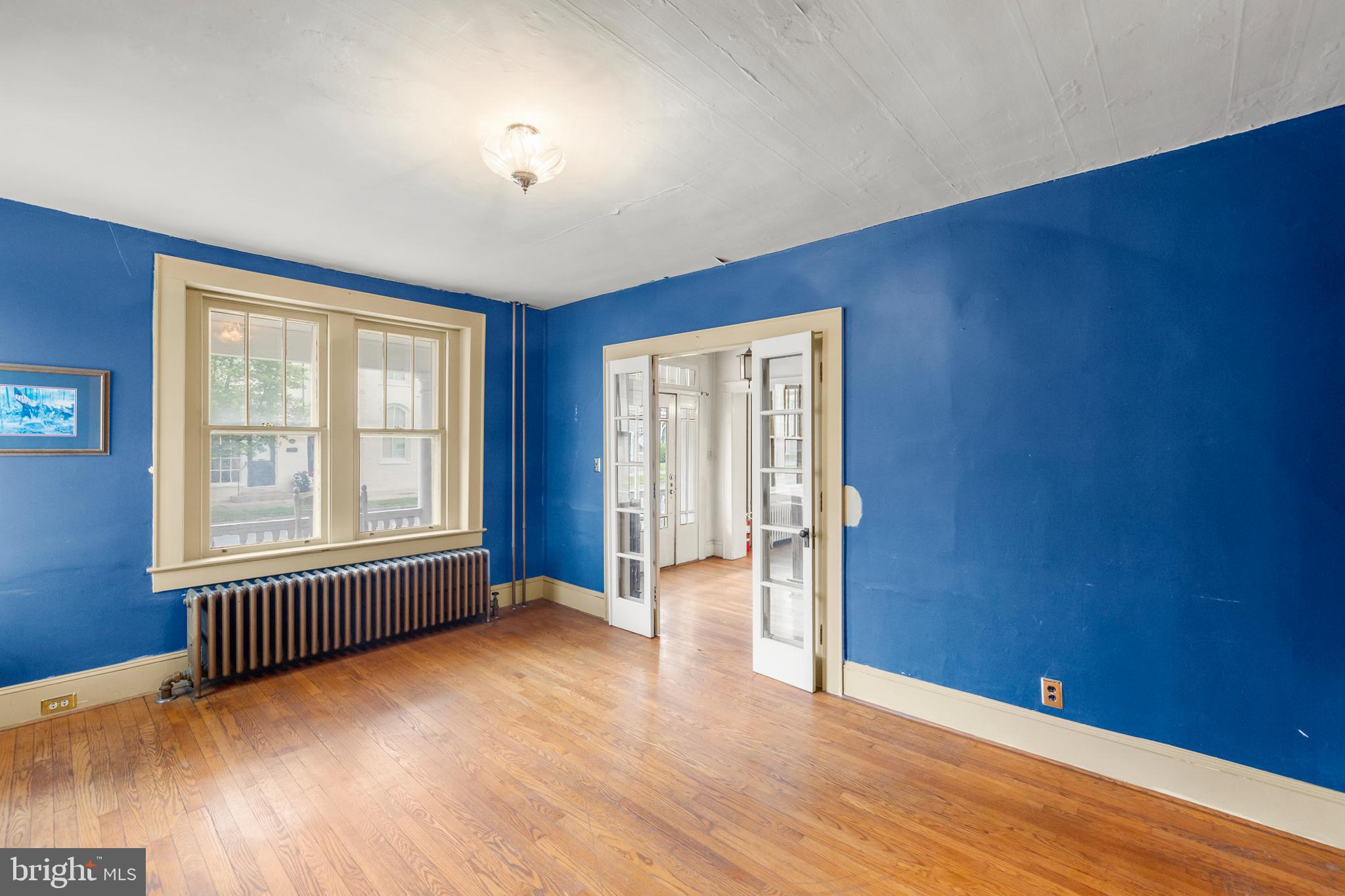 5342 Main Street Stephens City, VA 22655 - Photo 19 of 45 an empty room with wooden floor and windows