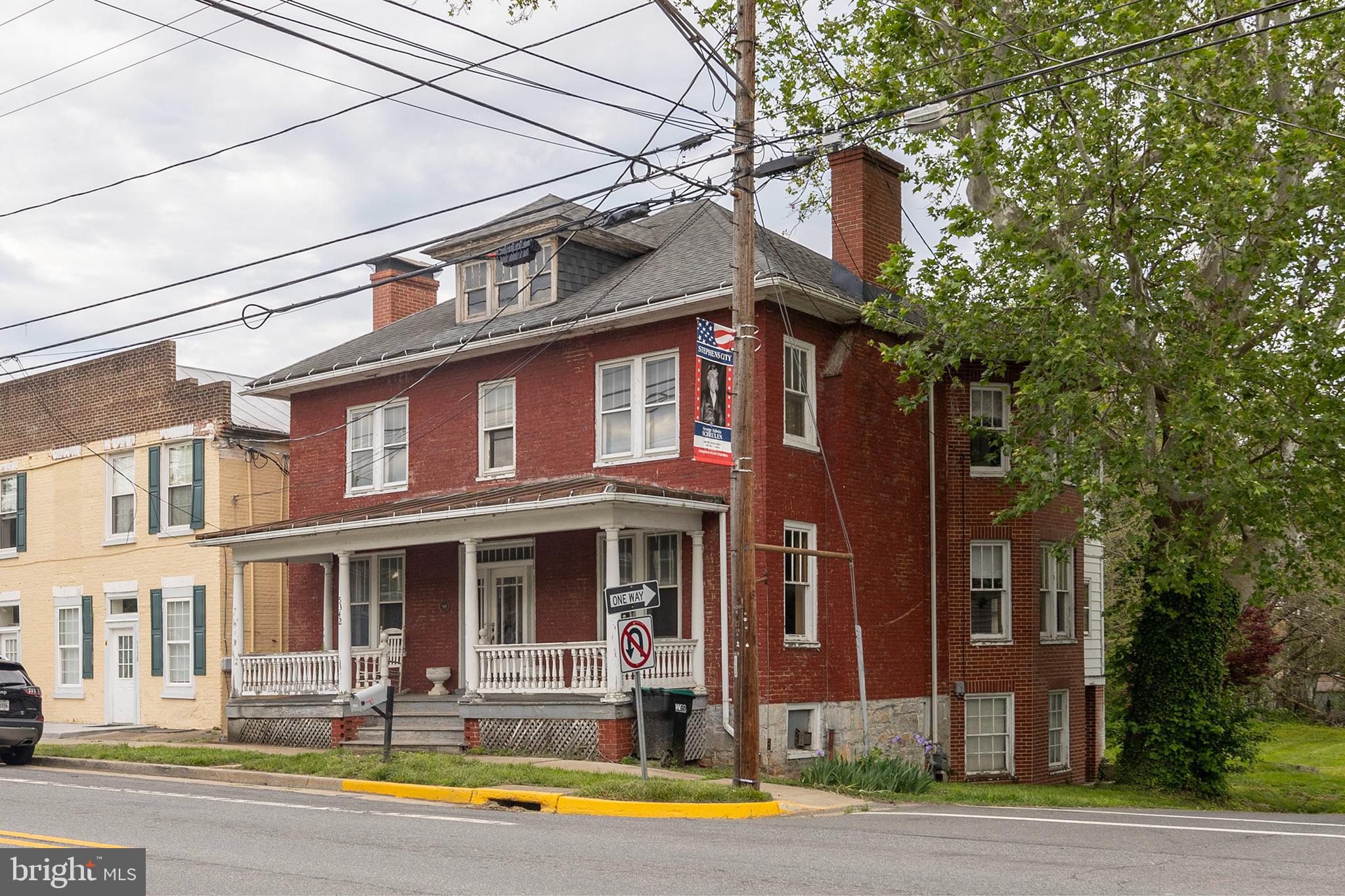 5342 Main Street Stephens City, VA 22655 - Photo 2 of 45 a front view of a building with street view and trees