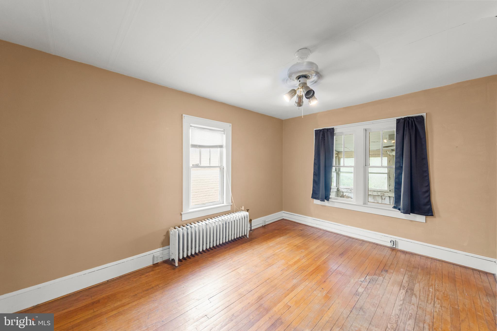 5342 Main Street Stephens City, VA 22655 - Photo 22 of 45 an empty room with wooden floor and windows