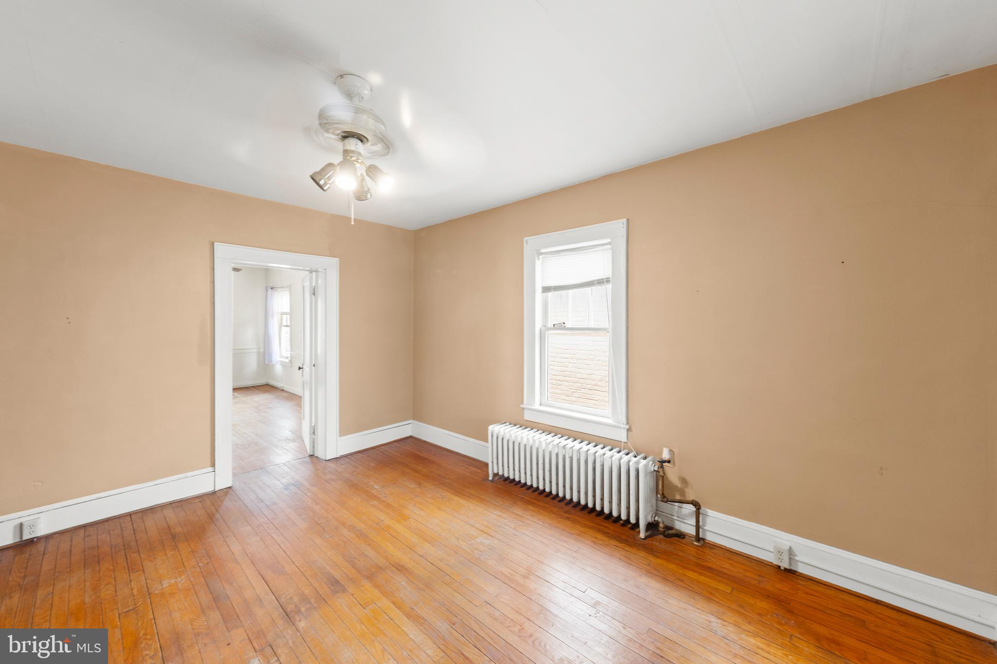 5342 Main Street Stephens City, VA 22655 - Photo 23 of 45 an empty room with wooden floor and windows