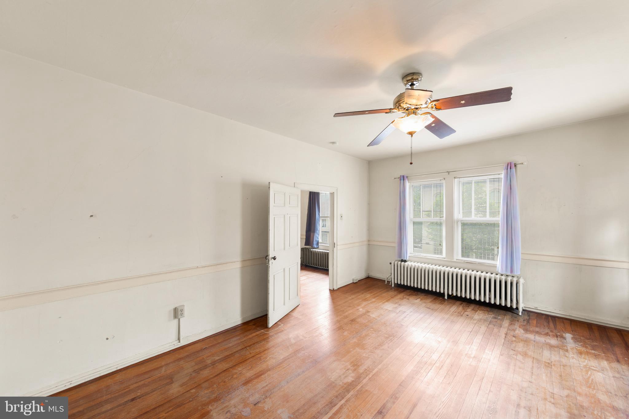 5342 Main Street Stephens City, VA 22655 - Photo 27 of 45 an empty room with wooden floor and windows