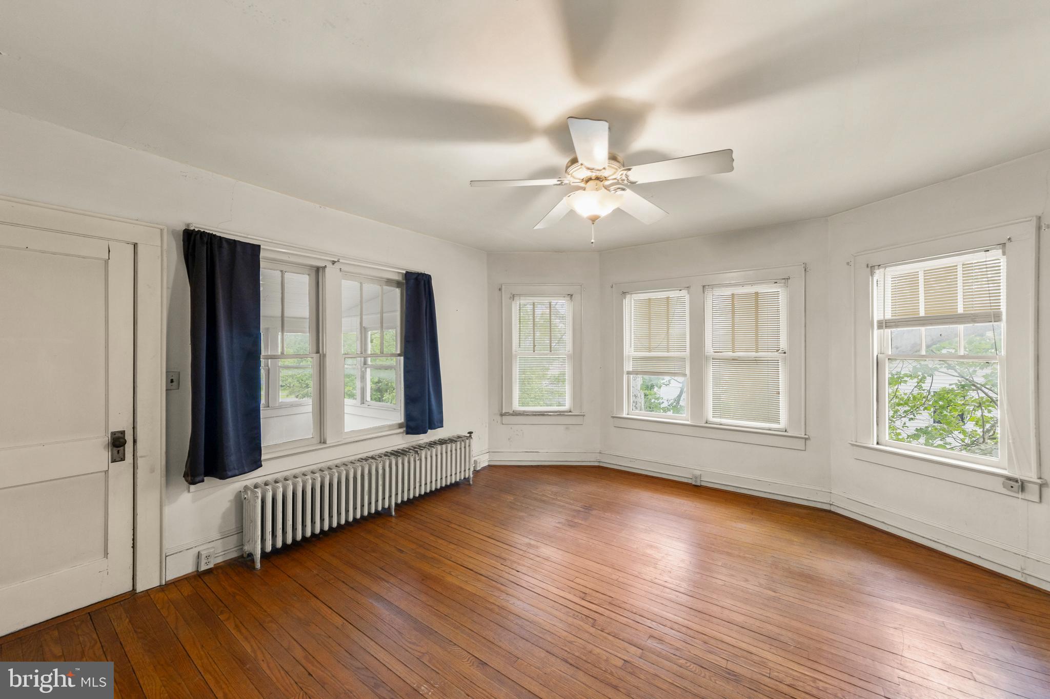 5342 Main Street Stephens City, VA 22655 - Photo 31 of 45 a view of an empty room with wooden floor and a window
