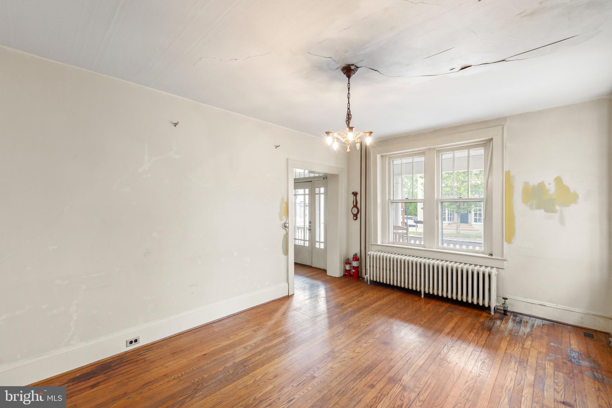 5342 Main Street Stephens City, VA 22655 - Photo 6 of 45 an empty room with wooden floor and windows