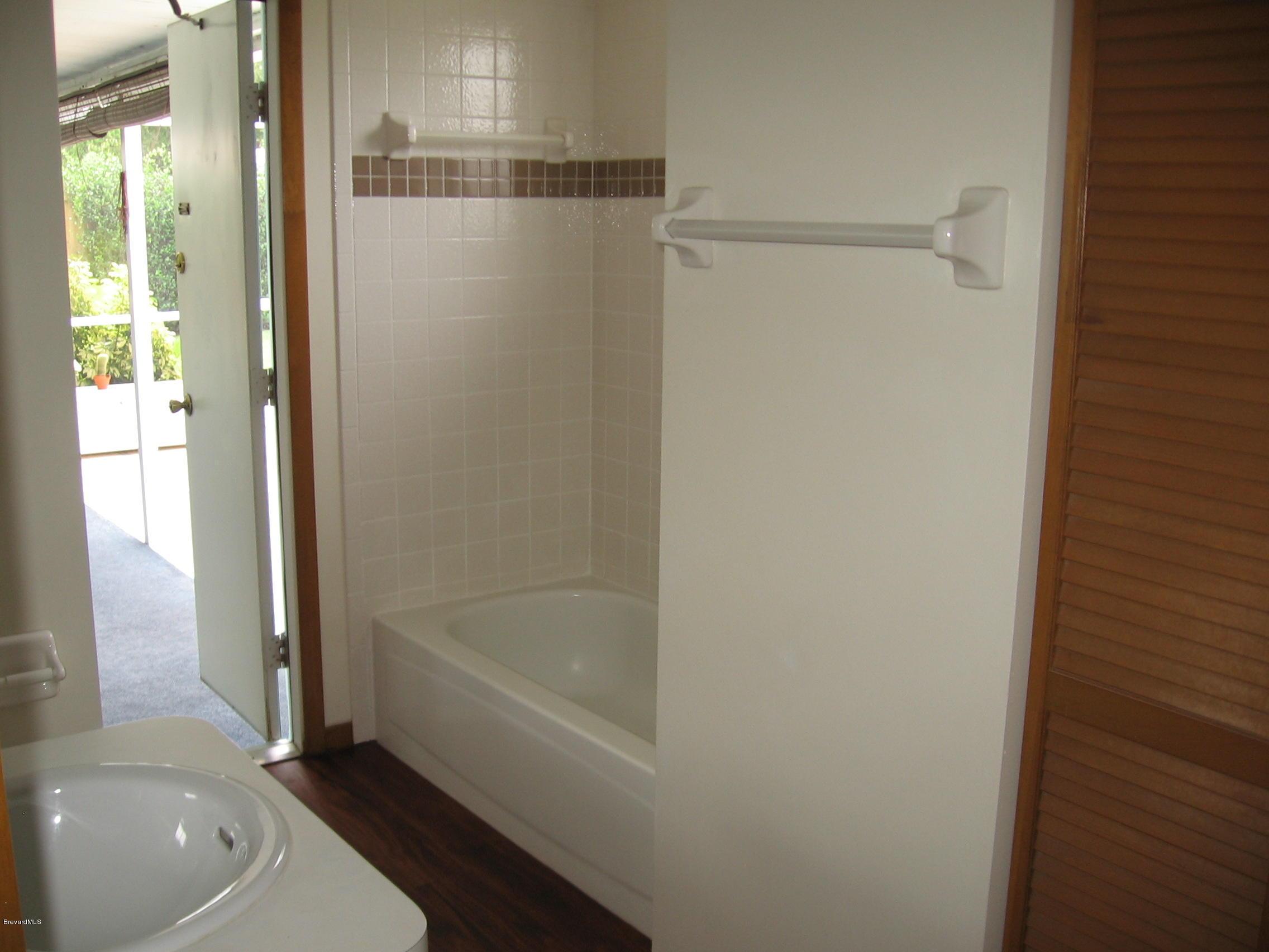5662 Jamaica Road Cocoa, FL 32927 - Photo 18 of 26 Bathroom to pool
