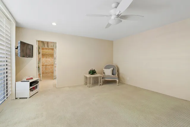 a room with a table and a potted plant