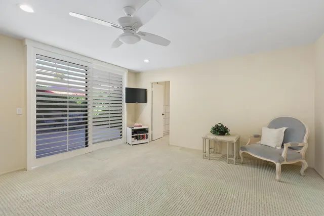 a spacious bathroom with a double vanity sink a mirror and a shower