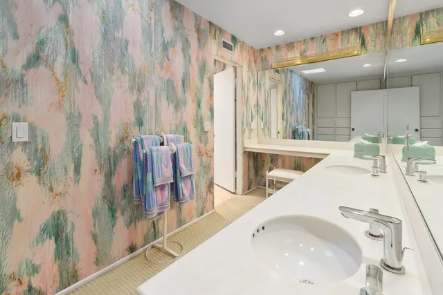 a white toilet sitting next to a shower curtain