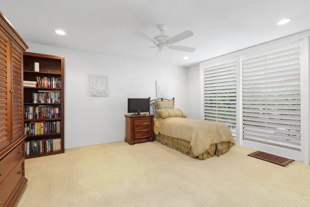 a view of a patio with couches chairs and a yard