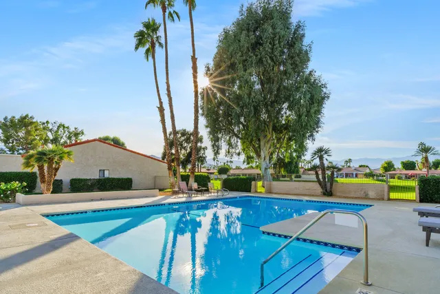 a view of a house with swimming pool