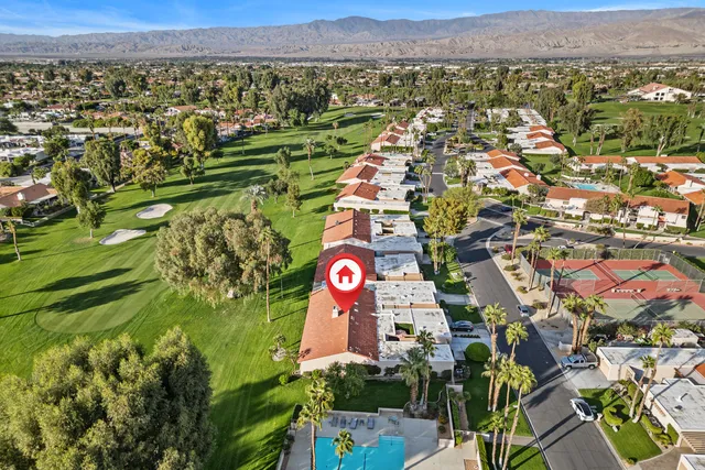 an aerial view of a house with a garden