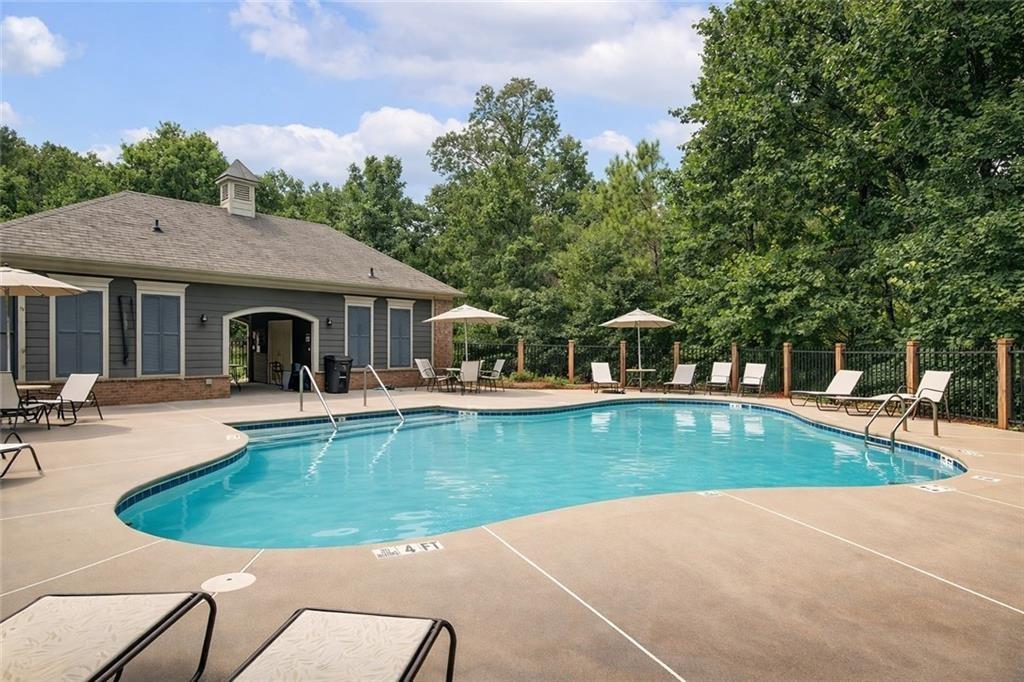 765 Trevett Way Marietta, GA 30066 - Photo 35 of 44 a view of a house with swimming pool and sitting area