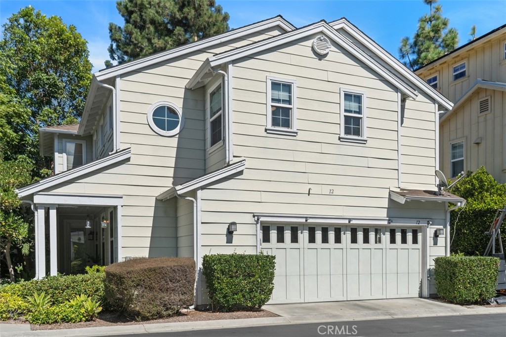 12 Rinehart Road Ladera Ranch, CA 92694 - Photo 1 of 1 a view of a white house with a small yard and plants